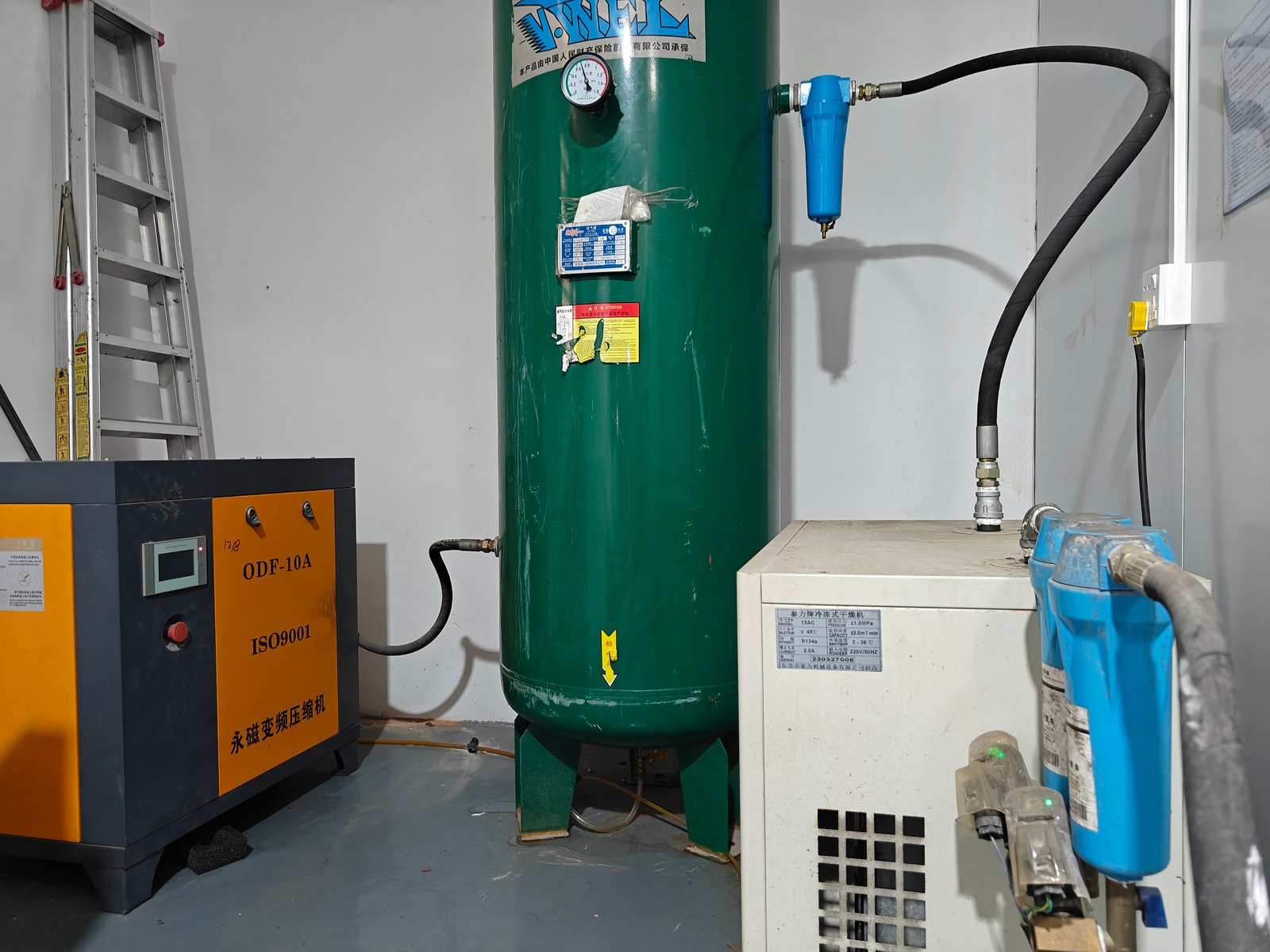 Screw compressor, air receiver tank and refrigerated dryer in the plant