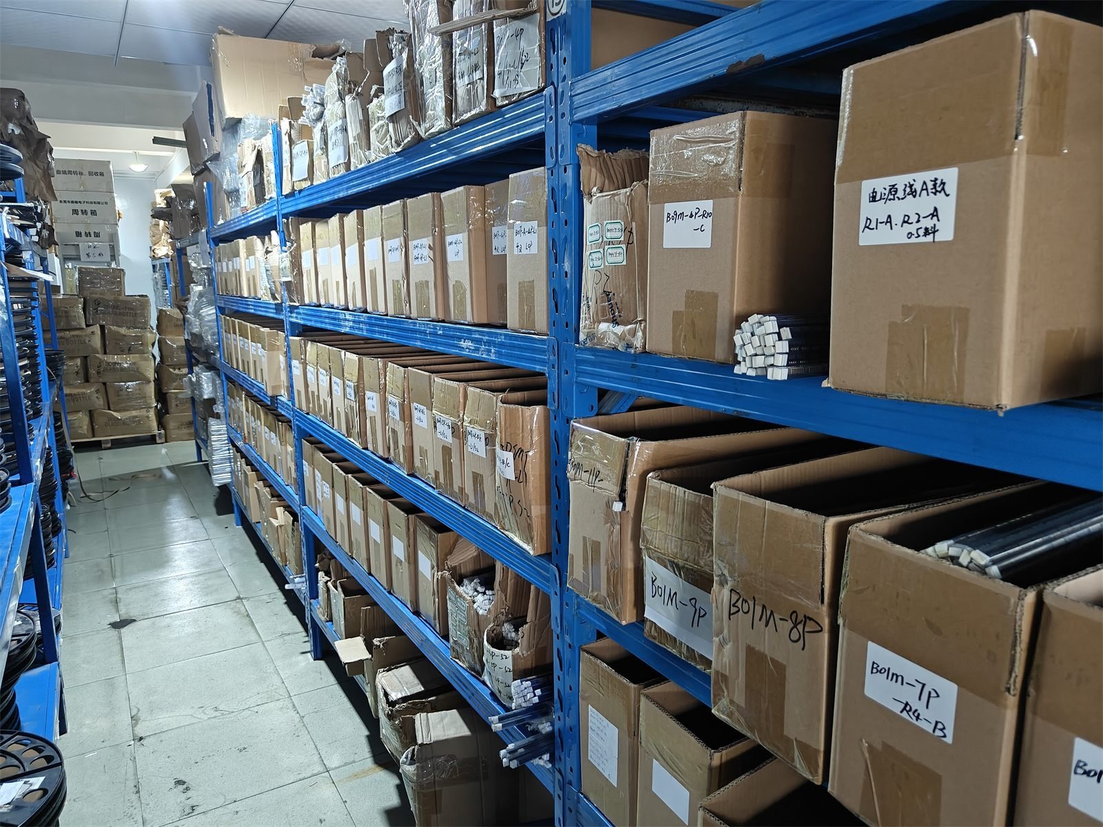 Warehouse shelves of packed goods at the Yuehang factory